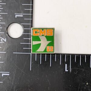 Vintage CMS 63 Enamel Pin Green Orange White Bird Jet Logo Square Lapel Badge